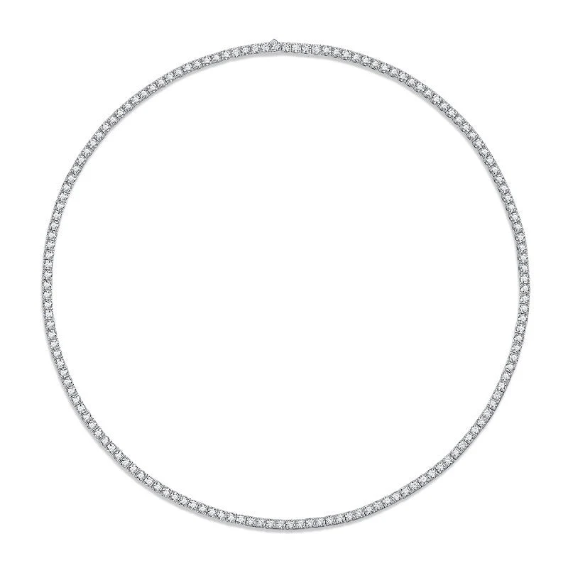 Full view of 3mm round moissanite tennis chain necklace laid in a smooth circle on white background
