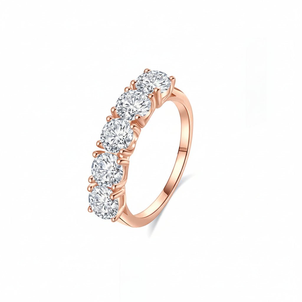 Angled profile view of Classic 5 Stone Round Moissanite Anniversary Wedding Band with Shared Prong Setting in Rose Gold