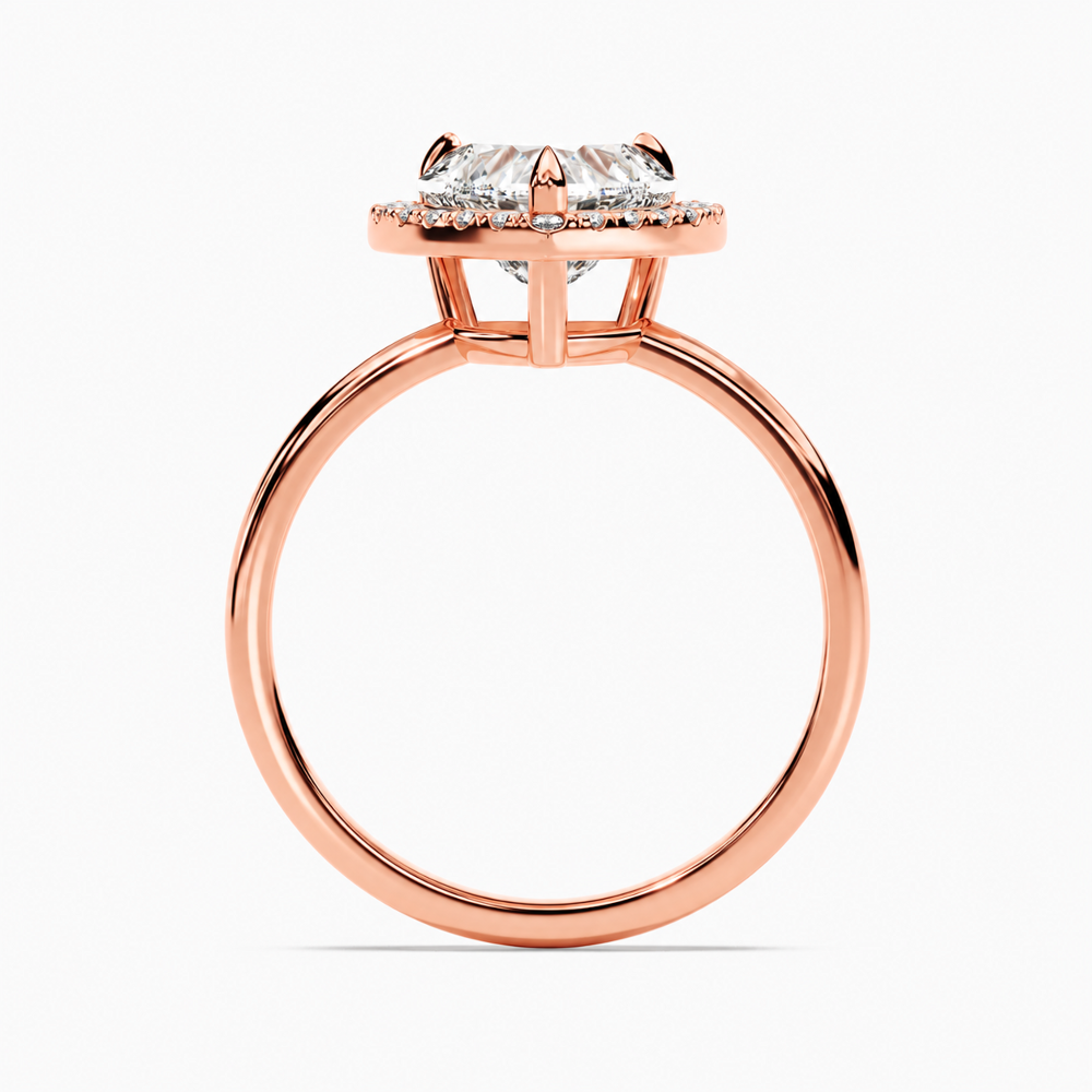 Rose gold heart shaped moissanite halo engagement ring direct side profile view showing halo platform
