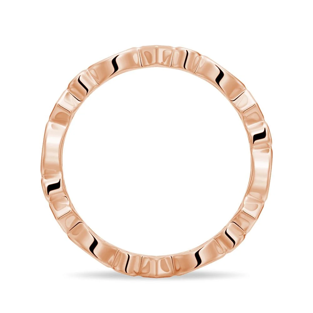 Side profile view of multi-shape bezel moissanite eternity band in rose gold color