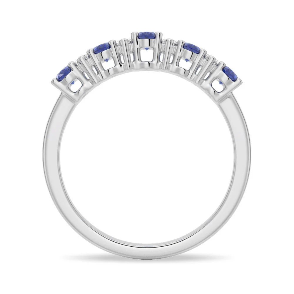 Full ring profile showing shared prong basket setting for blue and white sapphires