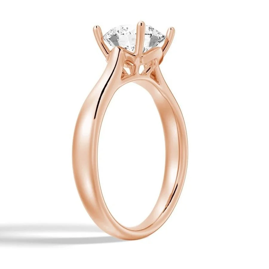 Rose gold round moissanite solitaire engagement ring side profile basket setting