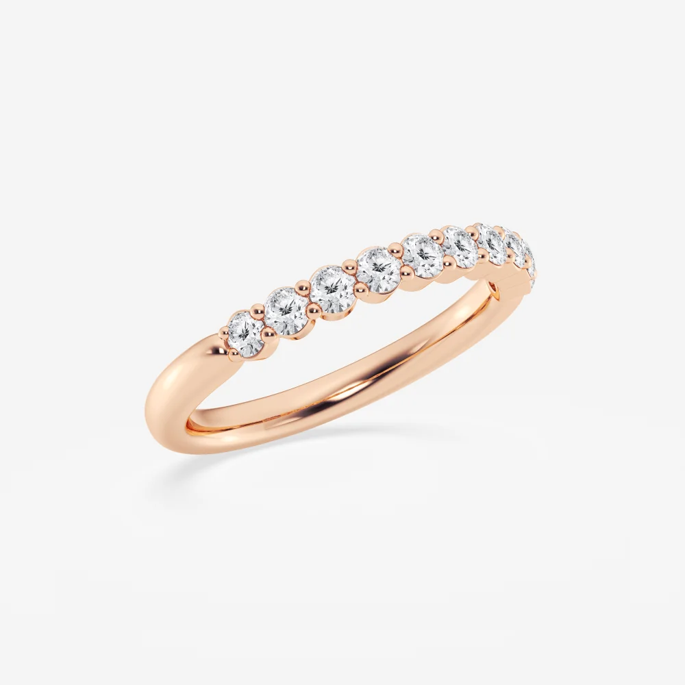 Three-quarter perspective view of round moissanite shared-prong wedding ring in rose gold