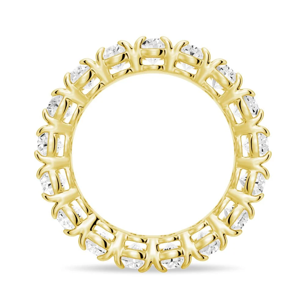 Side circular profile view of yellow gold oval cut moissanite ring