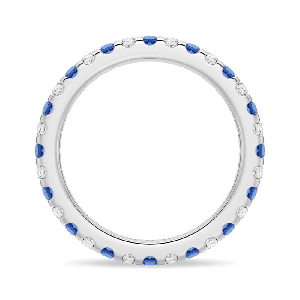 Direct front circular view of white gold alternating blue and white sapphire eternity ring