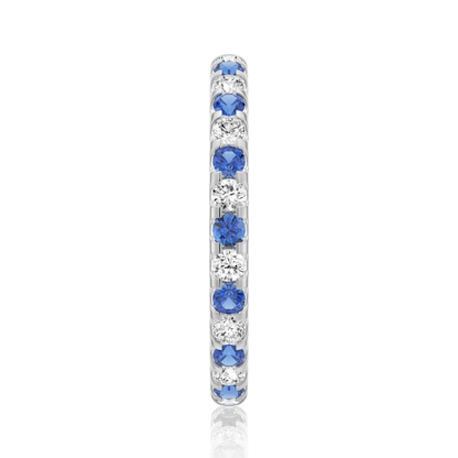Vertical side profile view of 2.6mm alternating blue and white sapphire U-prong band
