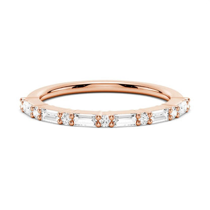 Front view of alternating baguette and round moissanite wedding band in rose gold