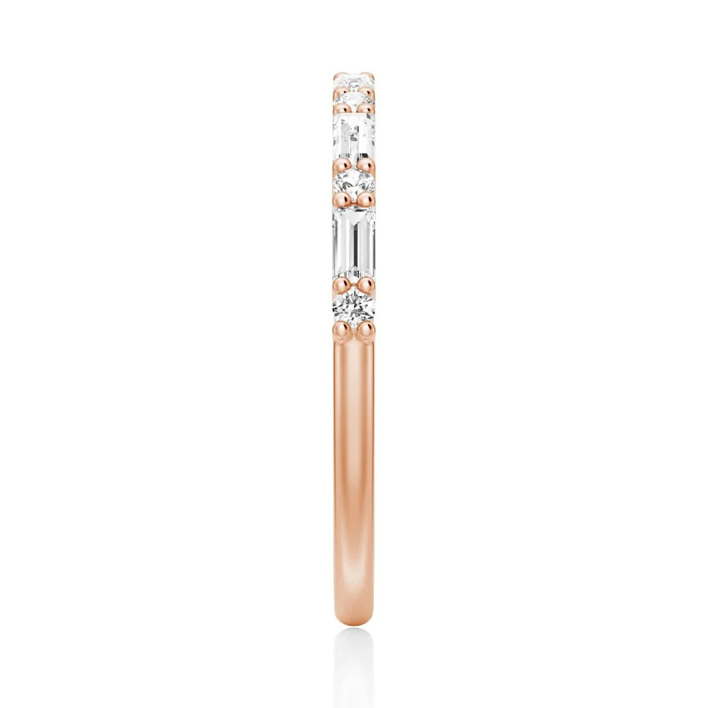Top view showing 2mm alternating baguette and round moissanite band in rose gold