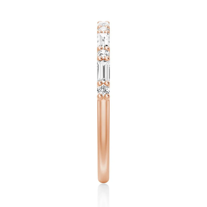Top view showing 2mm alternating baguette and round moissanite band in rose gold