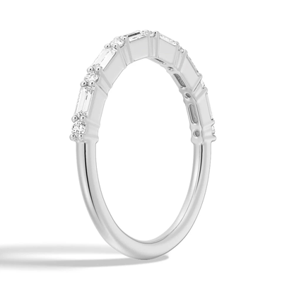 Three-quarter perspective view of baguette and round moissanite wedding band in white gold