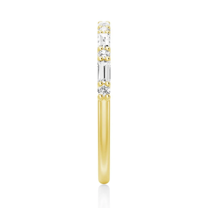 Top view showing 2mm alternating baguette and round moissanite band in yellow gold