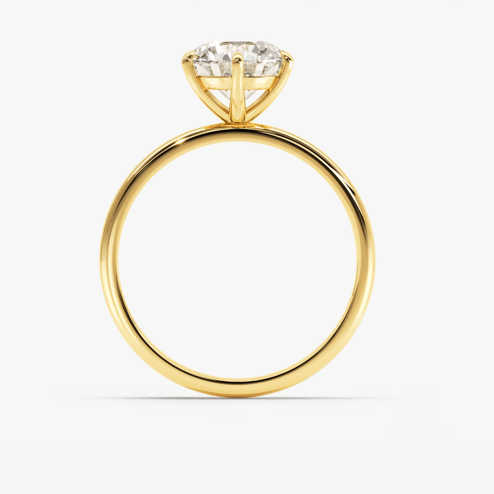 Profile view of Classic 6 Prong Round Cut Moissanite Engagement Ring in Yellow Gold 