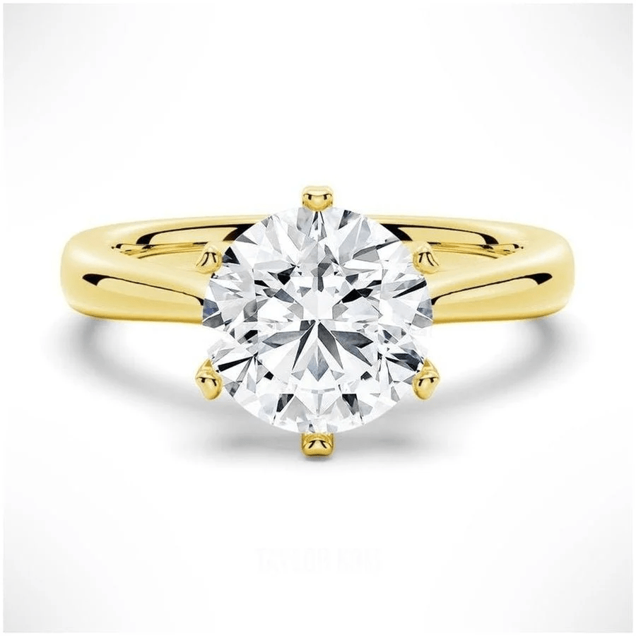 The Sophia Knife Edge 6 Prong Round Moissanite Engagement Ring in Yellow Gold