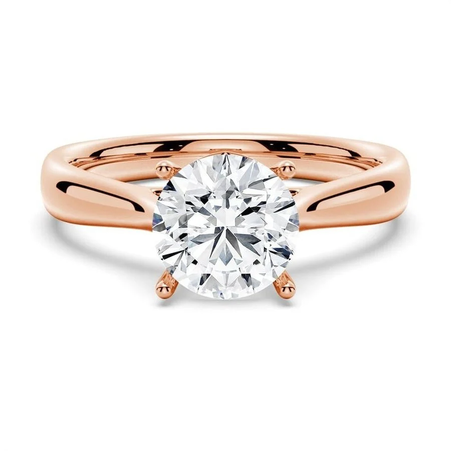 Rose gold classic four prong round moissanite solitaire engagement ring front view