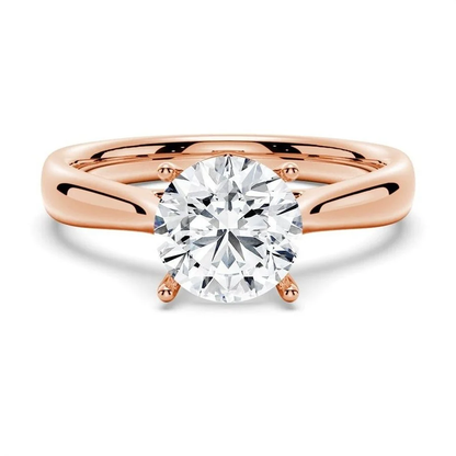 Rose gold classic four prong round moissanite solitaire engagement ring front view