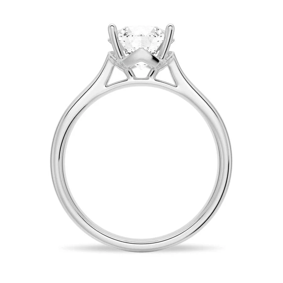 White gold four prong round moissanite solitaire ring side profile view