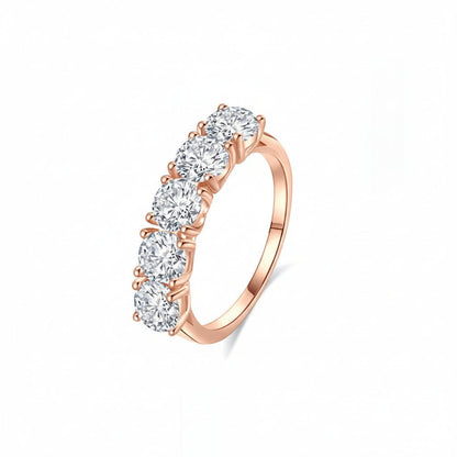 Angled profile view of Classic 5 Stone Round Moissanite Anniversary Wedding Band with Shared Prong Setting in Rose Gold