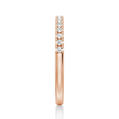 Vertical side profile view of 2.2mm round moissanite pave band in rose gold color