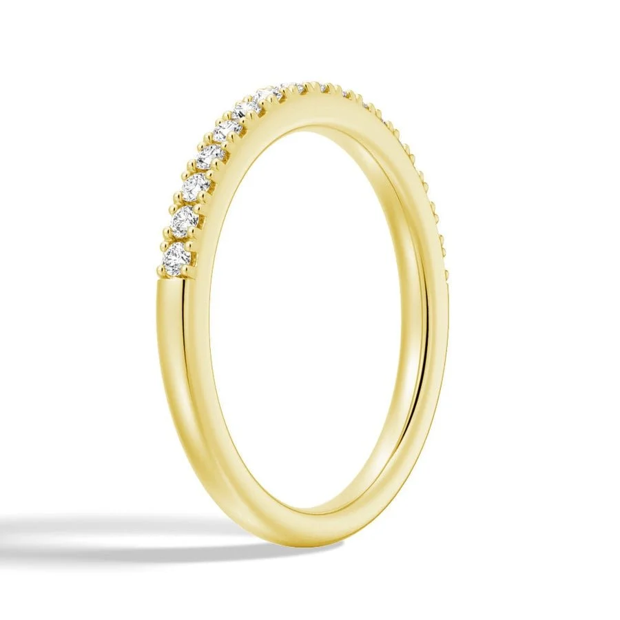 Three-quarter perspective view of classic 0.15ct TW round moissanite band in yellow gold color