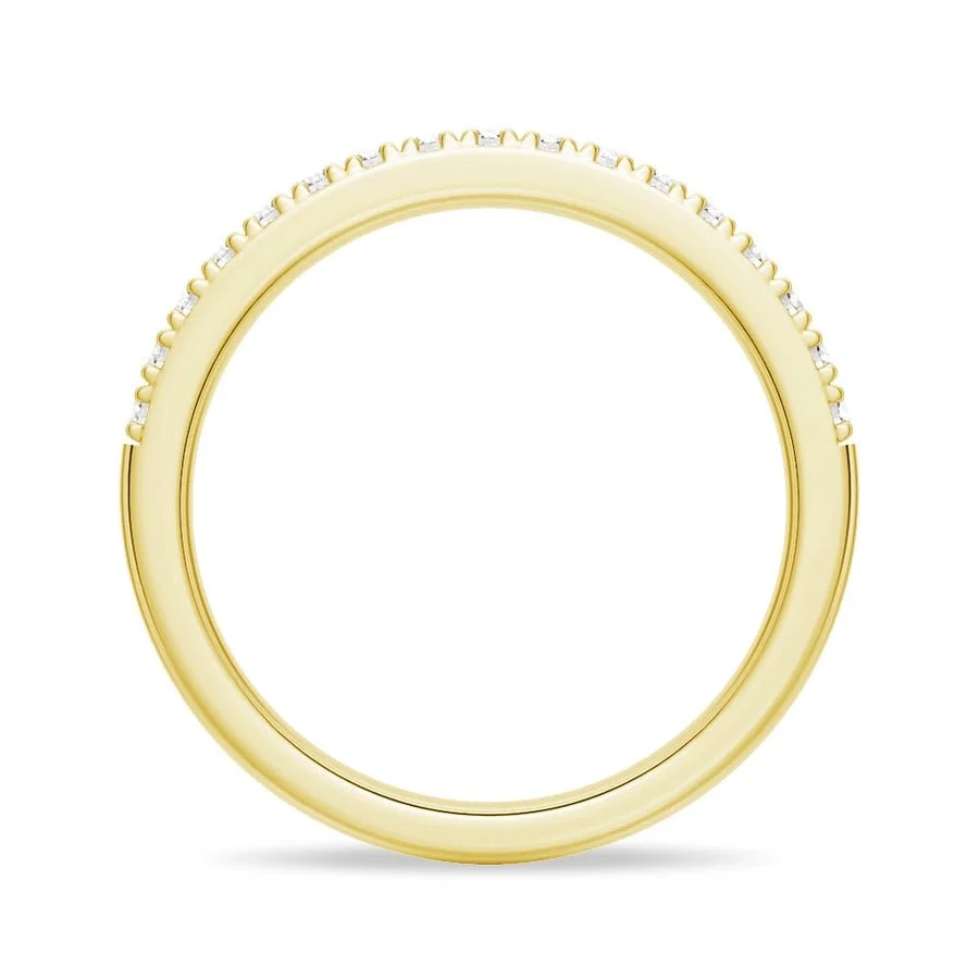Side view showing round inner band profile of pave moissanite ring in yellow gold color