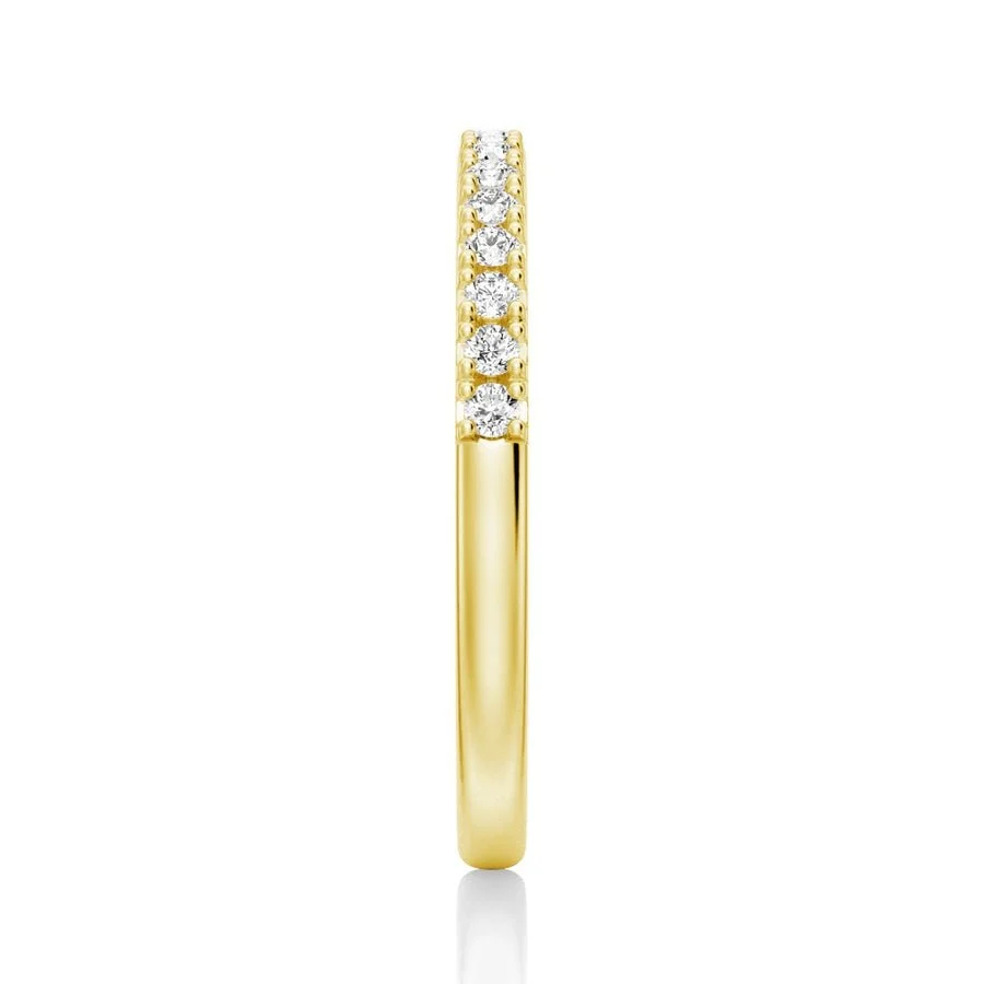 Vertical side profile view of 2.2mm round moissanite pave band in yellow gold color