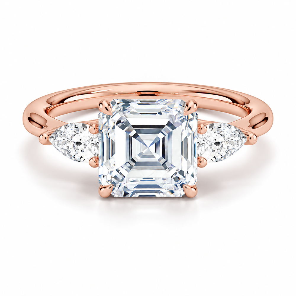 Rose gold classic three-stone asscher cut moissanite engagement ring top view with pear cut side stones