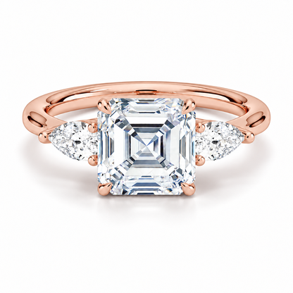 Rose gold classic three-stone asscher cut moissanite engagement ring top view with pear cut side stones