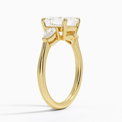 Yellow gold classic three-stone asscher cut moissanite engagement ring 3/4 side view showing claw prong basket