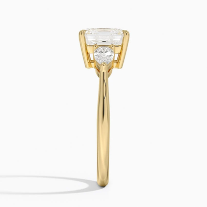 Yellow gold classic three-stone asscher cut moissanite engagement ring direct side profile view showing prong set pear accents