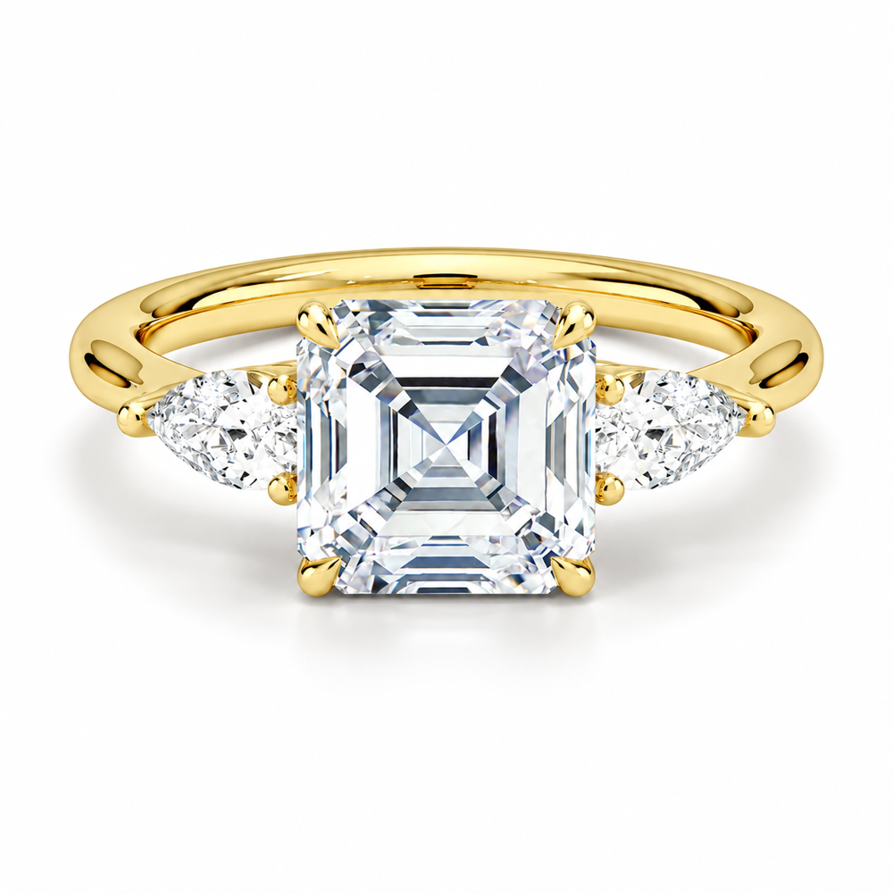 Yellow gold classic three-stone asscher cut moissanite engagement ring top view with pear cut side stones