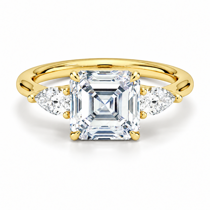 Yellow gold classic three-stone asscher cut moissanite engagement ring top view with pear cut side stones
