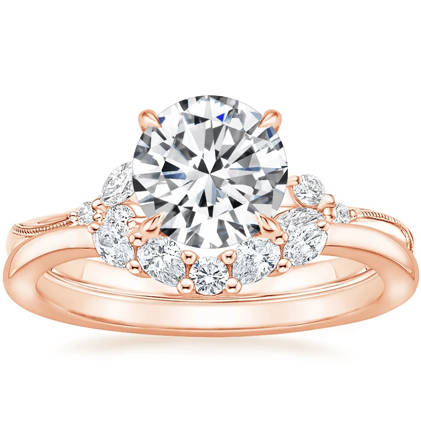 Rose gold curved cluster moissanite wedding band paired with engagement ring stack
