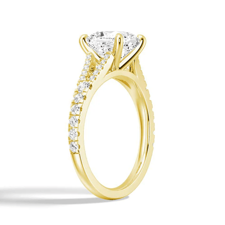 Angled profile view of Cushion Cut Moissanite Engagement Ring with Pave Split Shank Band in Yellow Gold