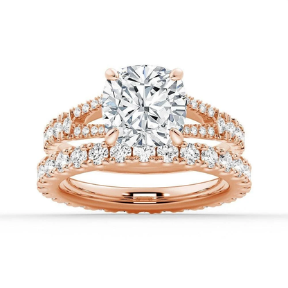 Rose gold cushion moissanite bridal set with pave engagement ring and matching wedding band