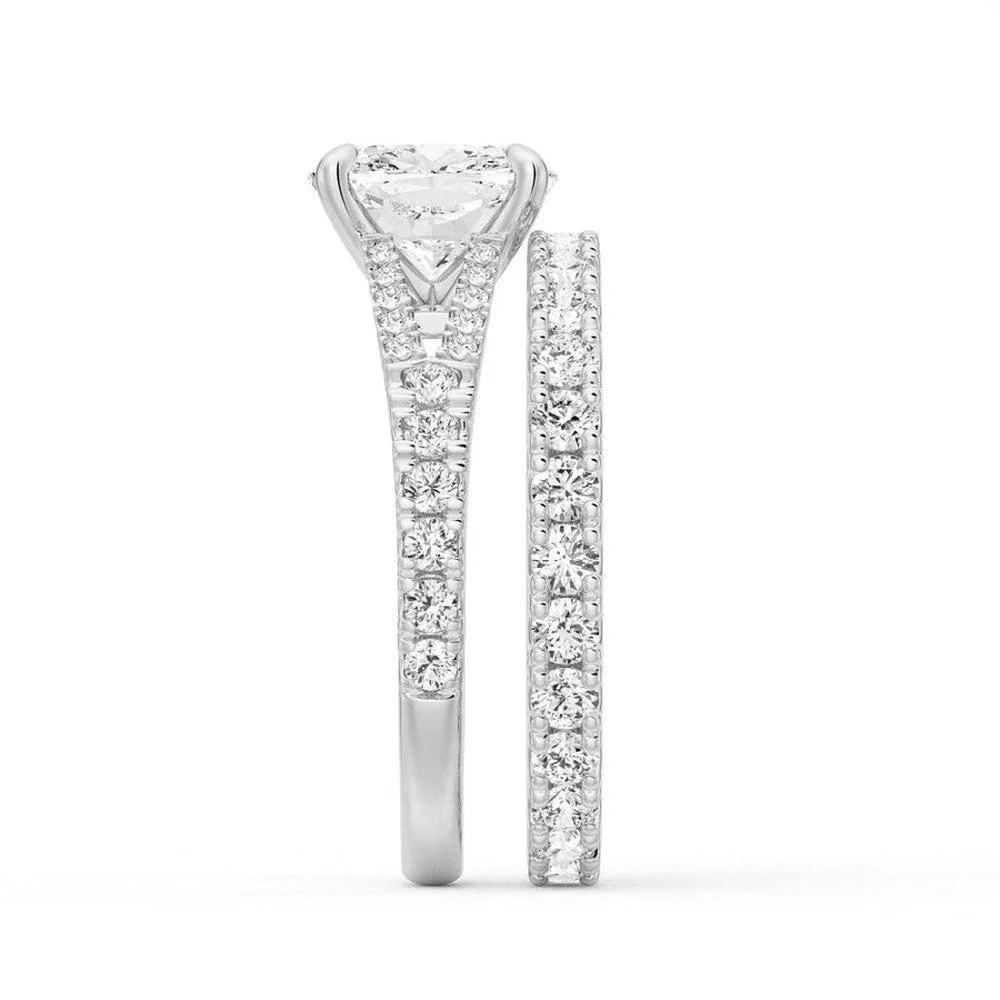 White gold cushion moissanite bridal set side profile view showing stacked engagement ring and pave band