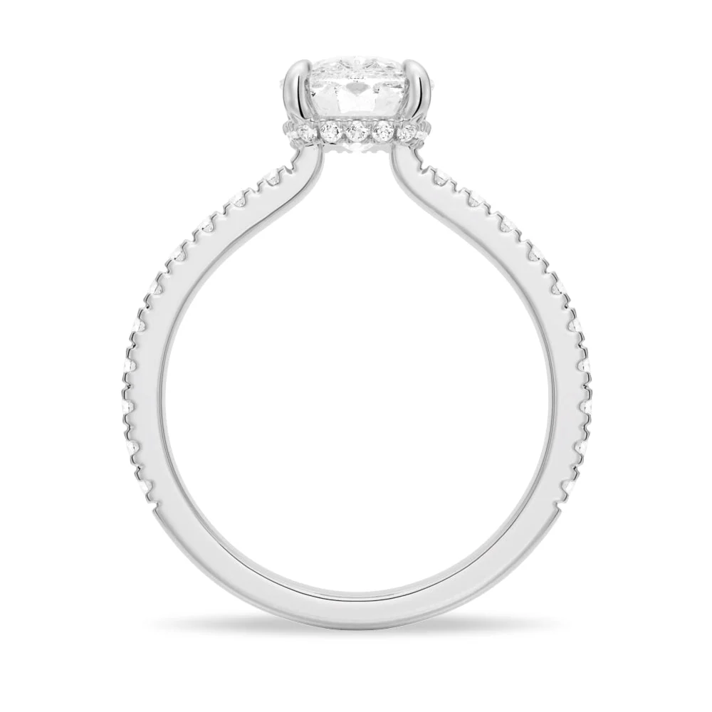 White gold cushion cut moissanite engagement ring direct side profile view showing hidden halo collar and pave band