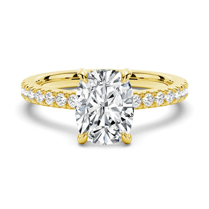 Yellow gold cushion cut moissanite engagement ring top view with pave diamond band