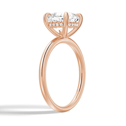 Rose gold cushion cut moissanite engagement ring 3/4 side low angle perspective view showing plain band