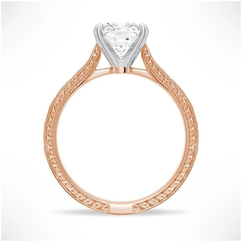 Rose gold cushion cut moissanite engagement ring side profile view showing filigree scrollwork and white gold head