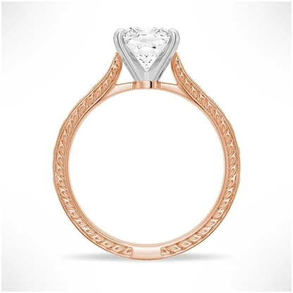 Rose gold cushion cut moissanite engagement ring side profile view showing filigree scrollwork and white gold head