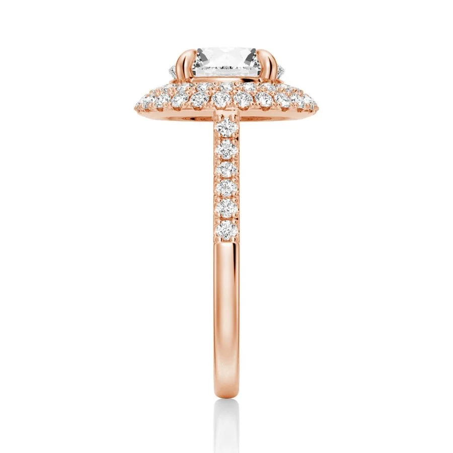 Rose gold double halo round moissanite ring side view showing pave band details