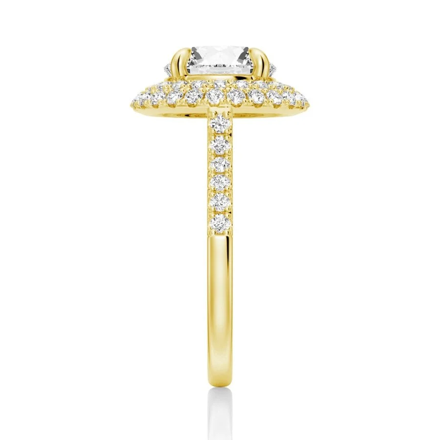 Yellow gold double halo round moissanite ring side view showing pave band details