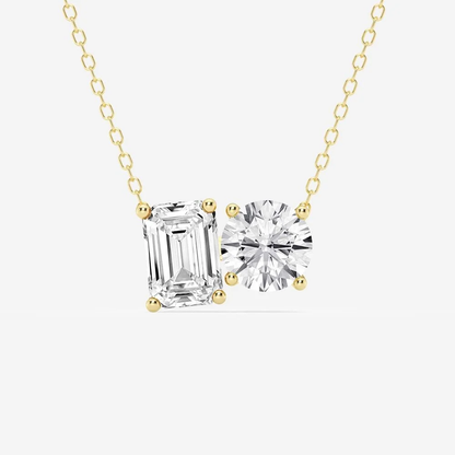 Yellow gold east-west emerald cut and round moissanite two-stone pendant necklace top view