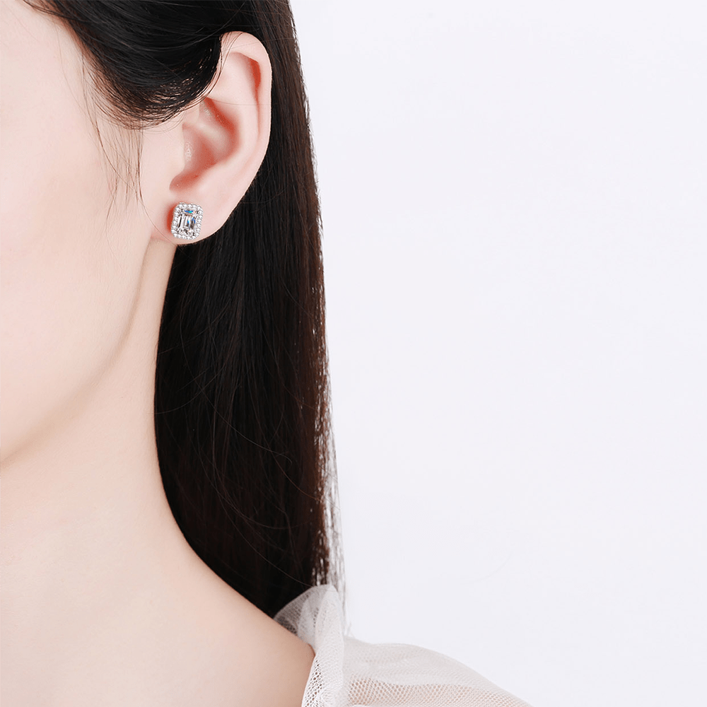 Emerald Cut Moissanite Stud Earrings Worn on Ear in White Gold - Novelle Vow