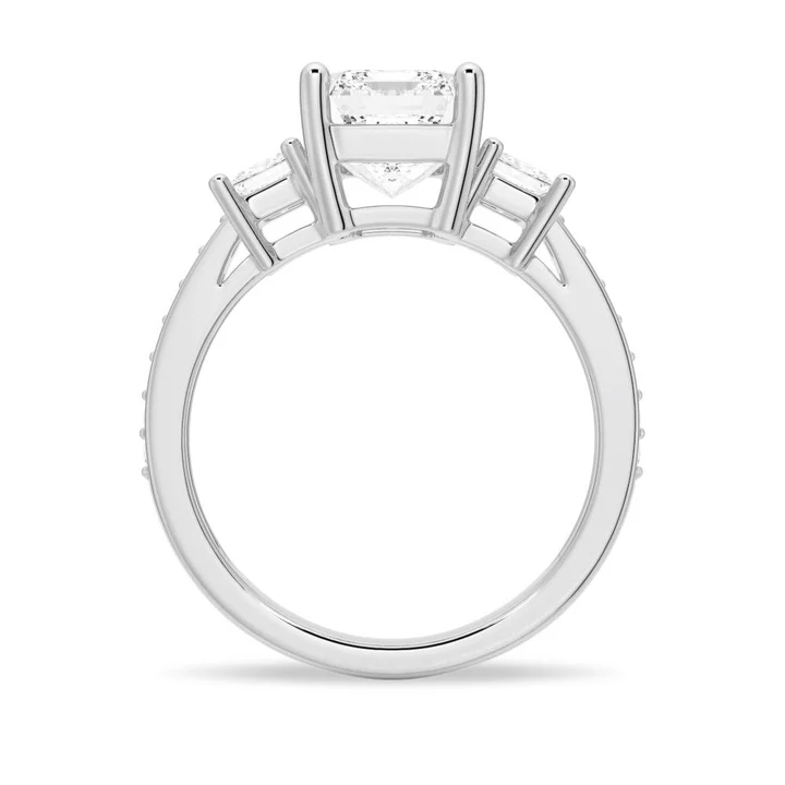 Profile view of Emerald Cut Three Stone Moissanite Engagement Ring with Pave Band in White Gold