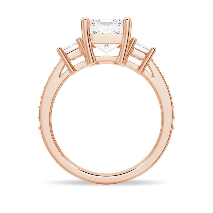 Profile view of Emerald Cut Three Stone Moissanite Engagement Ring with Pave Band in Rose Gold