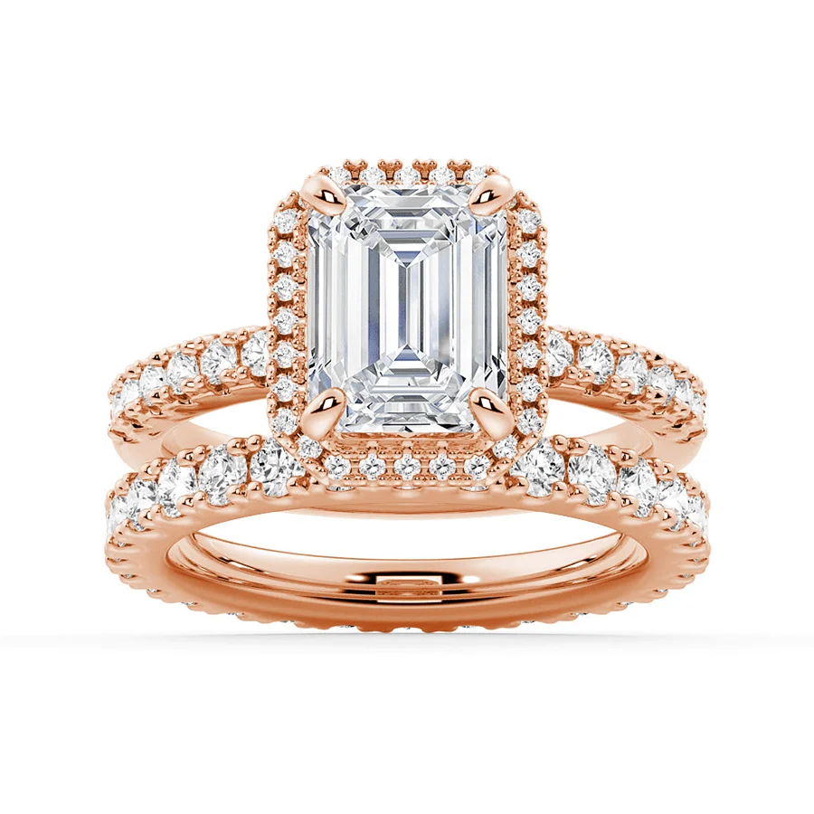 Rose gold emerald cut moissanite bridal set with halo engagement ring and matching pave wedding band
