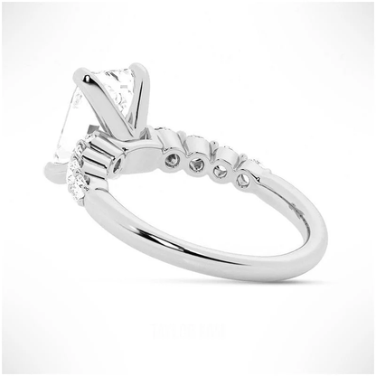 White gold emerald cut moissanite engagement ring 3/4 side low perspective view showing shared-prong gallery construction