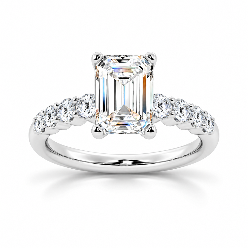 White gold emerald cut moissanite engagement ring top view with shared-prong round side stones-Novelle Vow