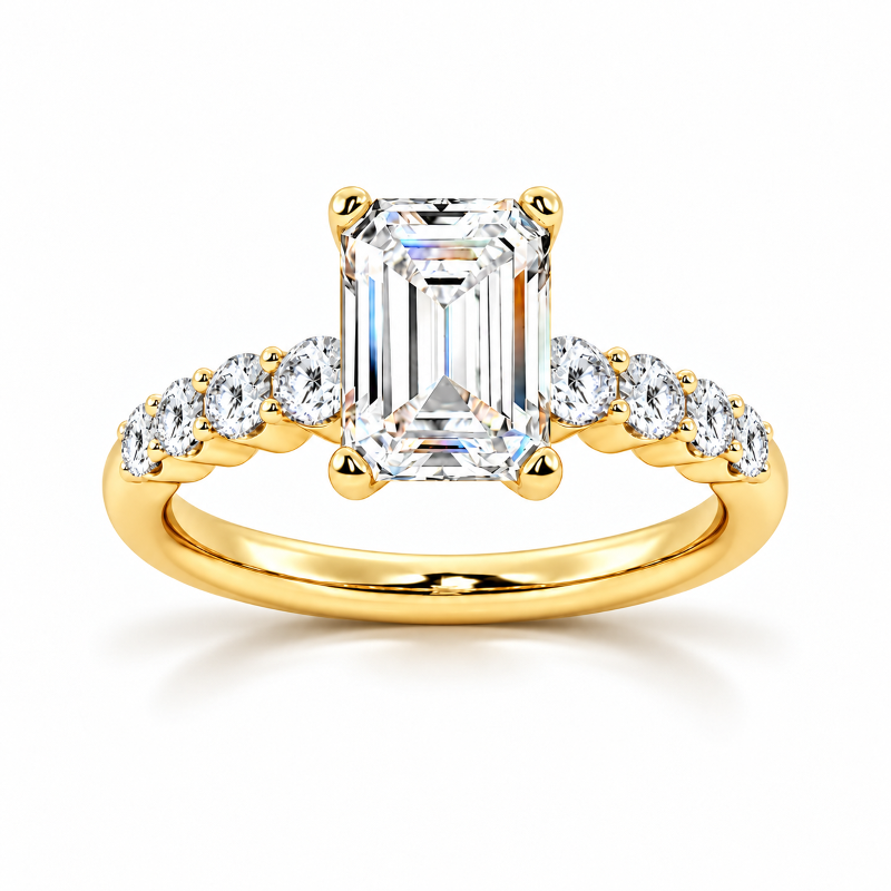 Yellow gold emerald cut moissanite engagement ring top view with shared-prong round side stones